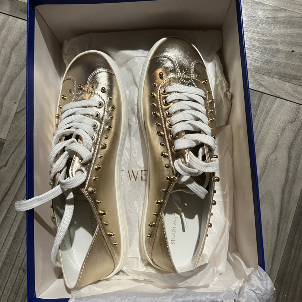 Metallic Stuart Weitzman leather sneaker with studs